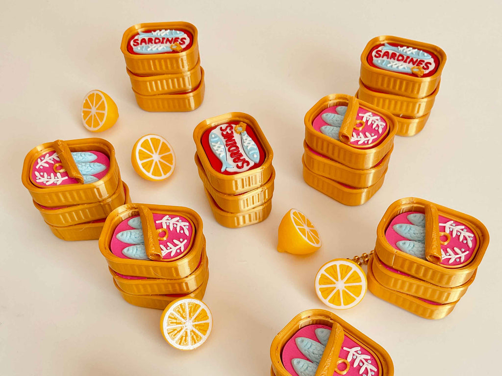 Sardine clicker with a little lemon keychain