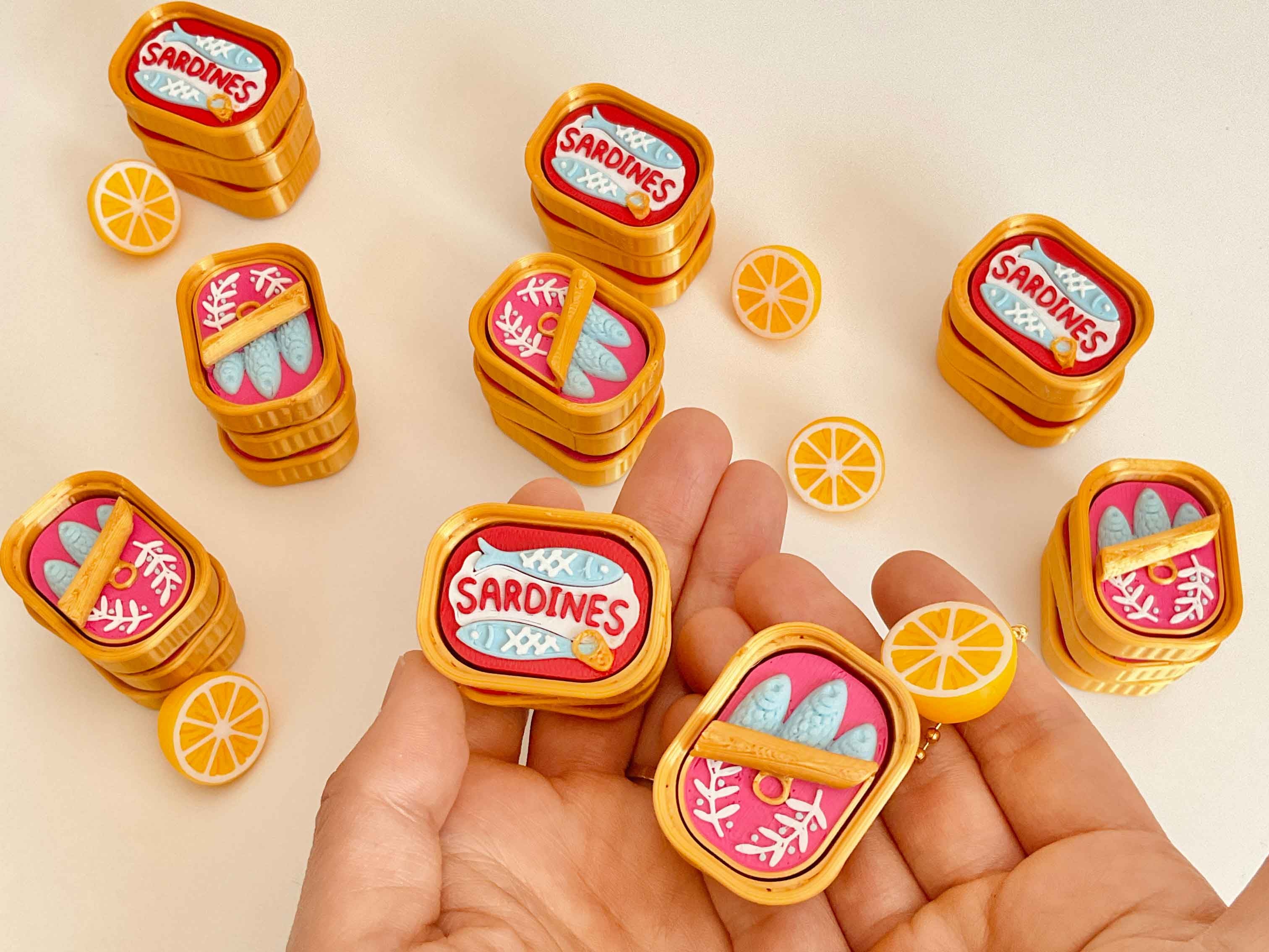 Sardine clicker with a little lemon keychain